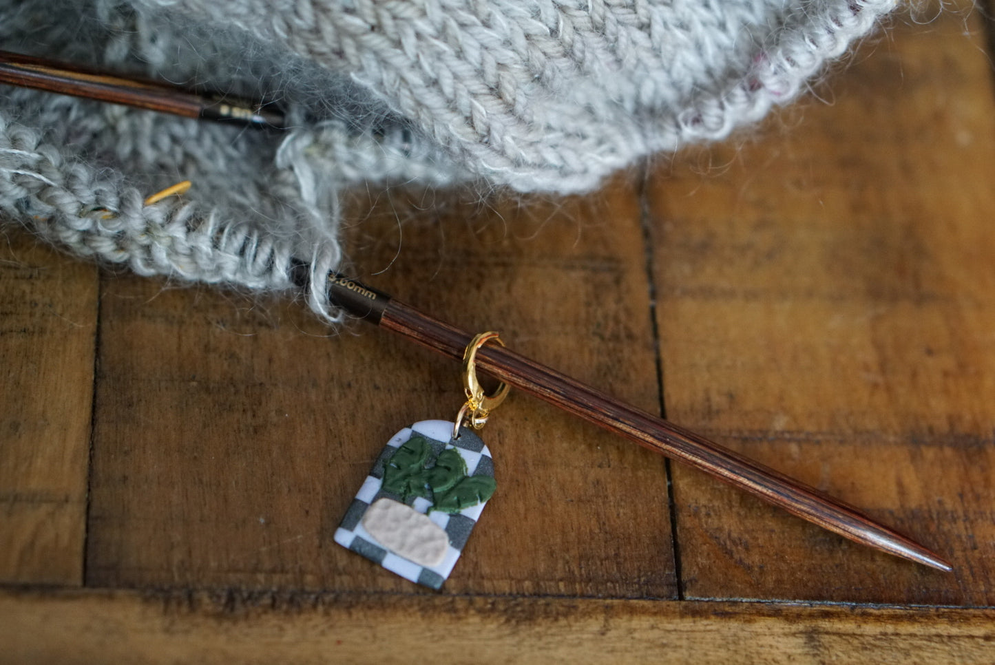 Checkerboard monstera stitch marker